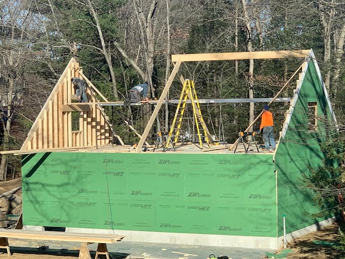 Our crew framing the second floor of a garage on a winter morning
