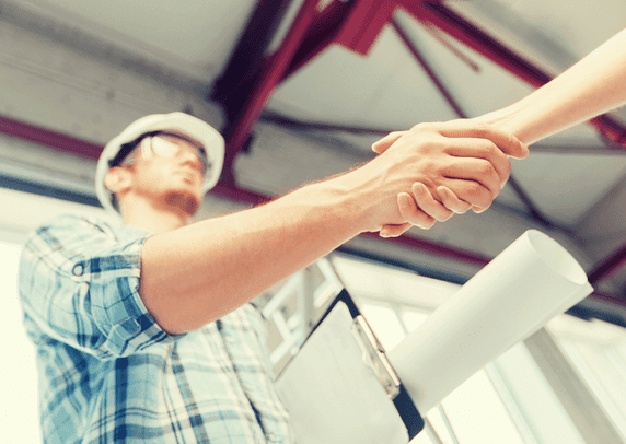 Garage builder shaking hands with a New Hampshire homeowner