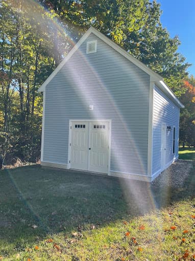 Two storey detached garage with double entry doors, finished in autumn